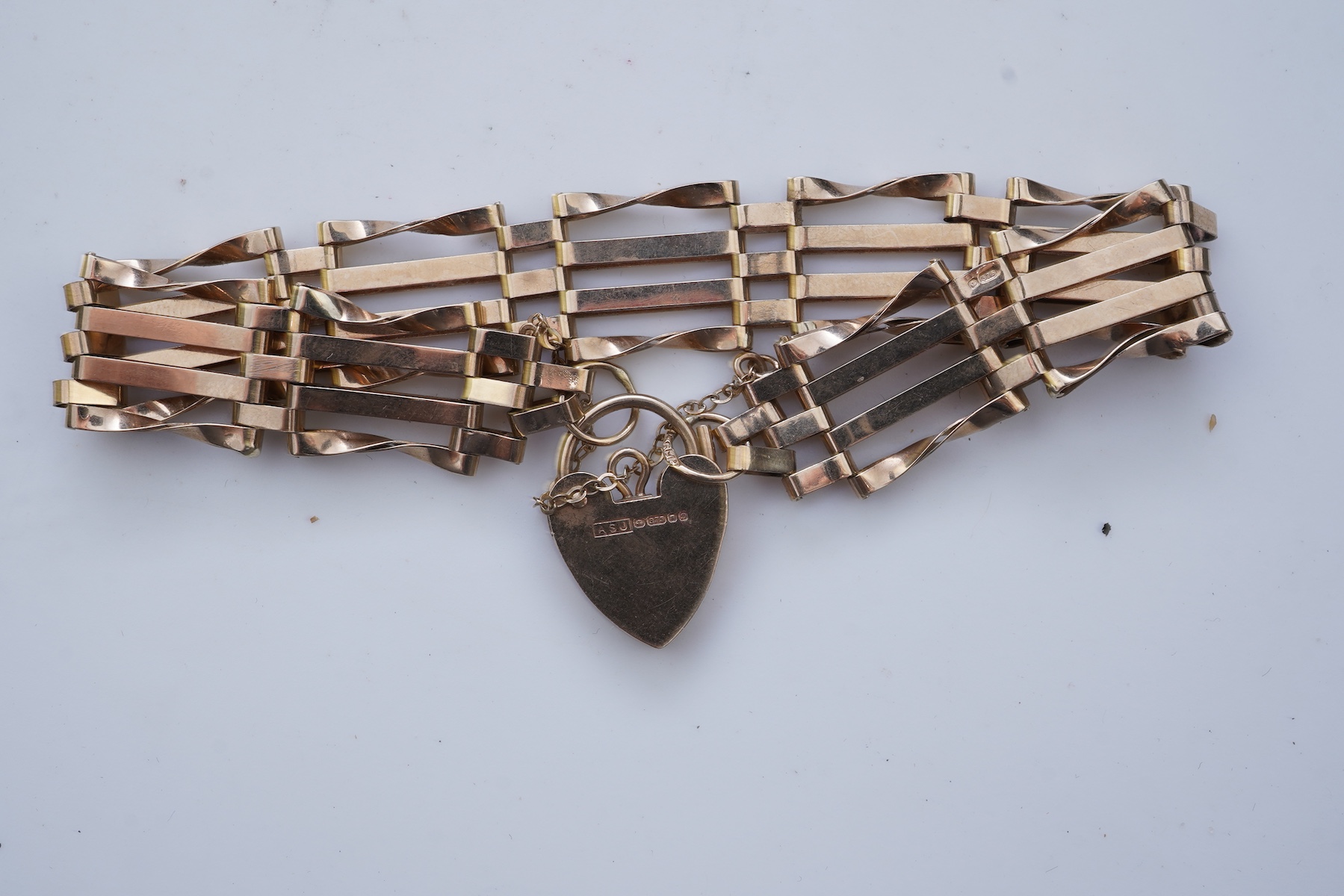 Two gold bracelets and a gold watch